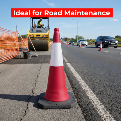 Red and white traffic cone on a road with road maintenance 