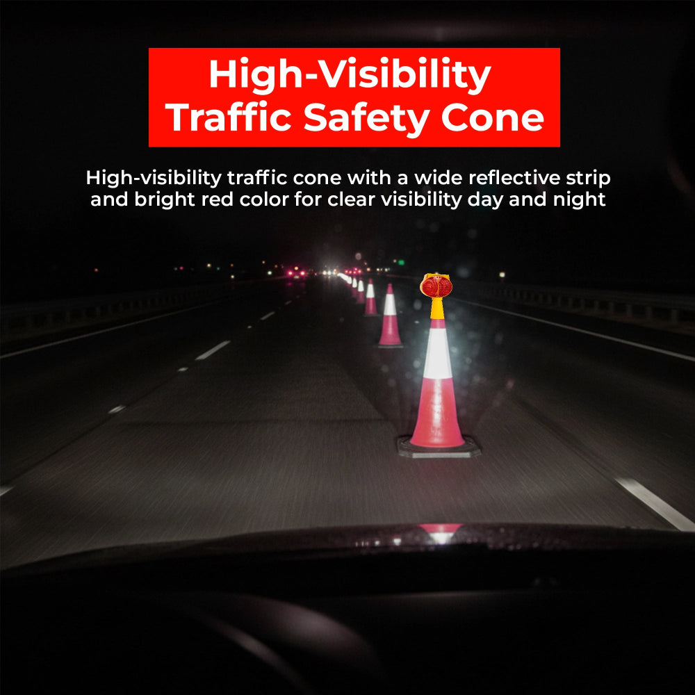 High-visibility traffic safety cone on a dark road with reflective strip