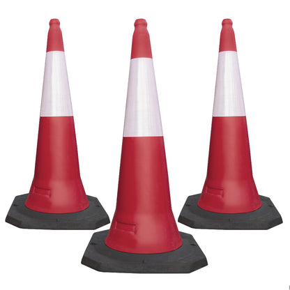 Three red and white reflective traffic cones 