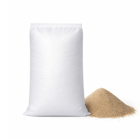White bag of sand with a small pile of sand on a white background
