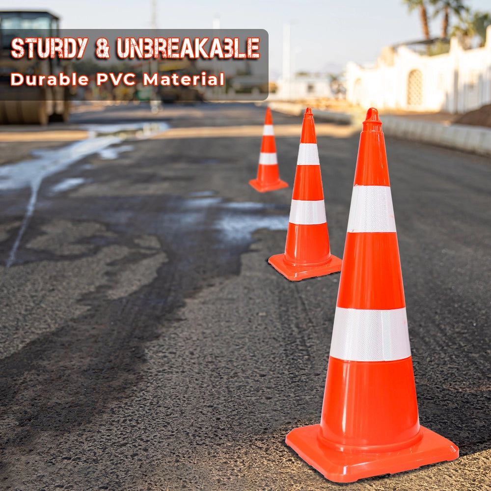 Three orange and white PVC traffic cones 