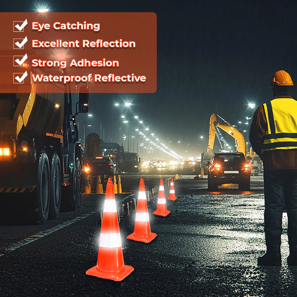 A set of glowing orange reflective traffic cones 