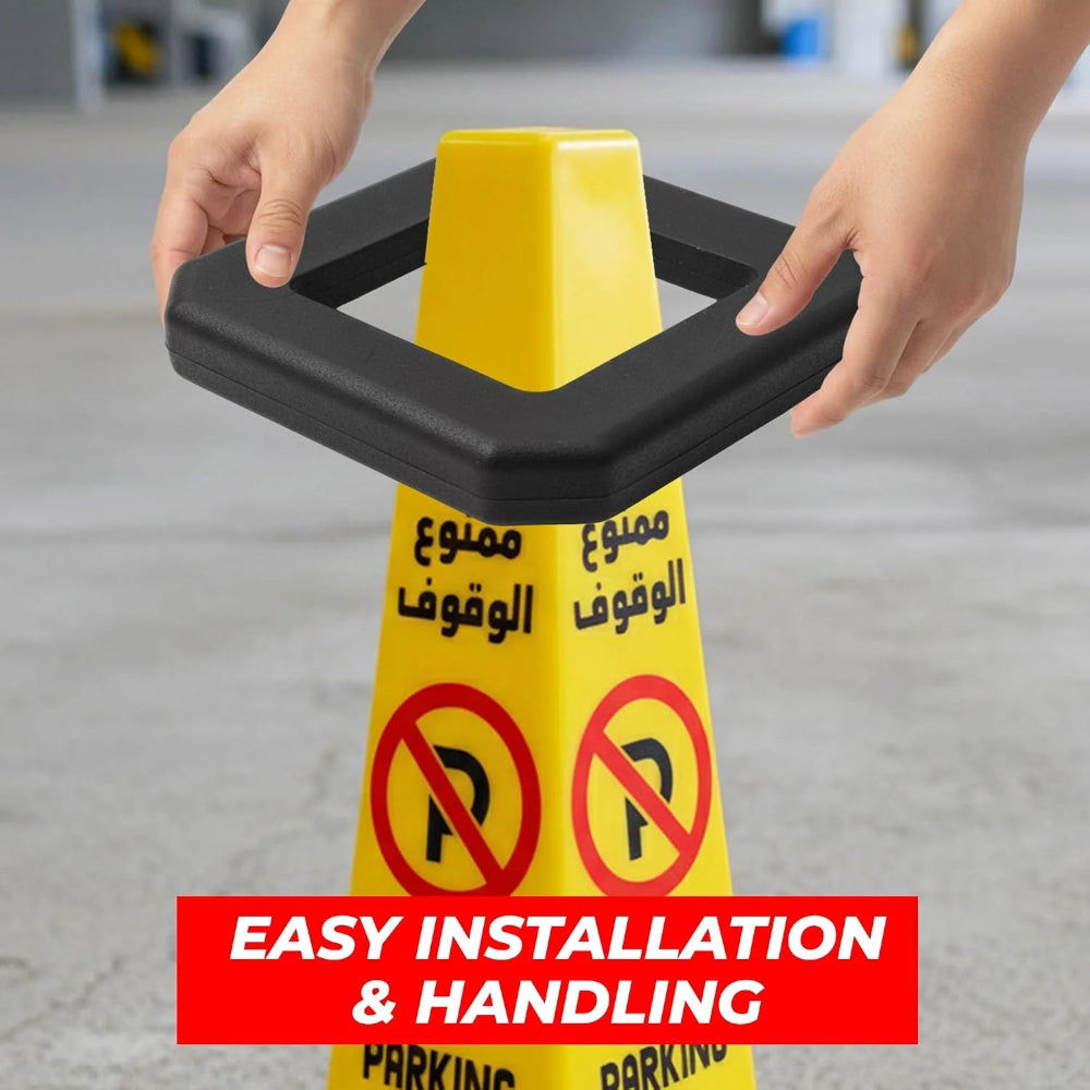 A yellow parking cone with a black rectangular base 