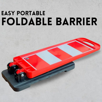 A red and white striped portable foldable barrier 