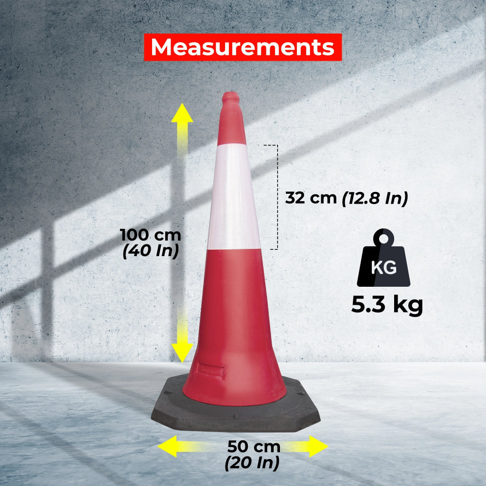 Red traffic cone with measurements labeled on a concrete floor.
