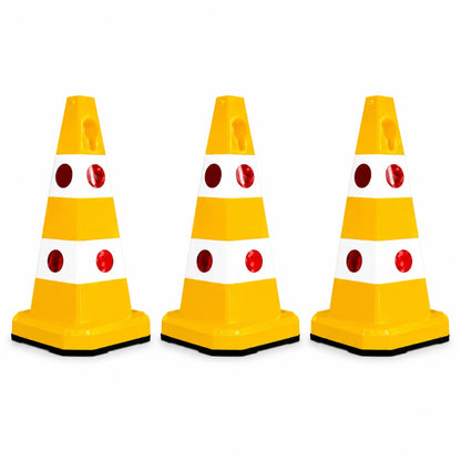 Three yellow and white plastic traffic safety cones