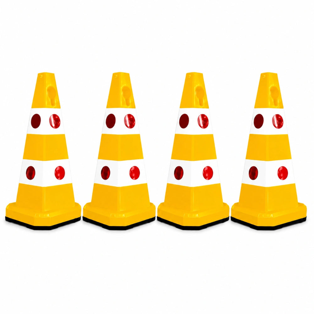 Four yellow and white plastic traffic safety cones 