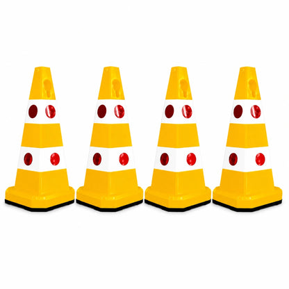 Four yellow and white plastic traffic safety cones 