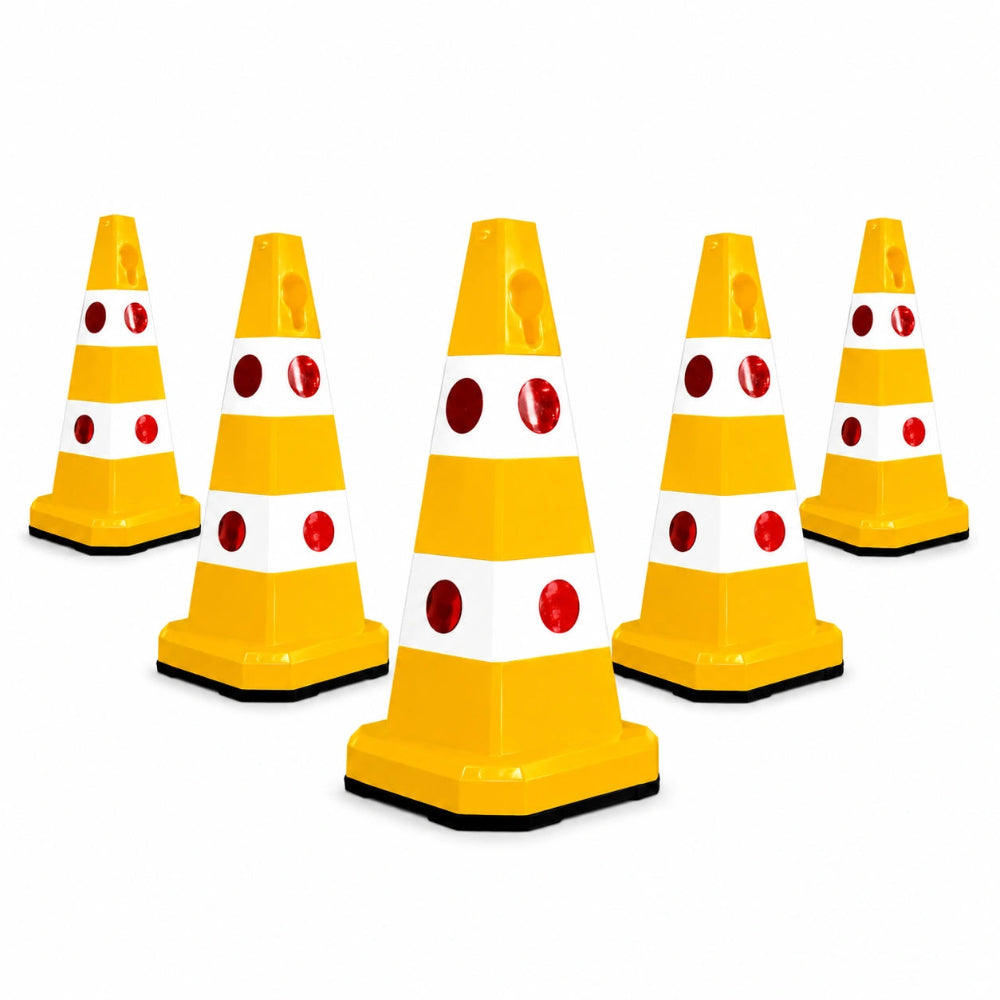 Five yellow and white traffic safety cones