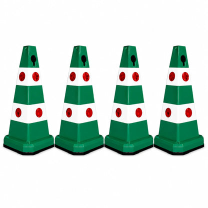 Four green and white plastic traffic safety cones