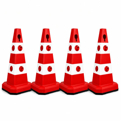 Four red and white plastic traffic safety cones